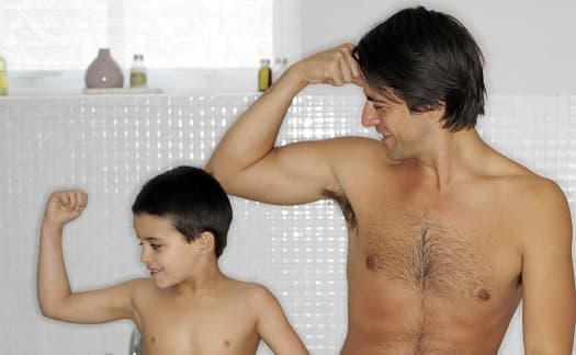 man playing with son